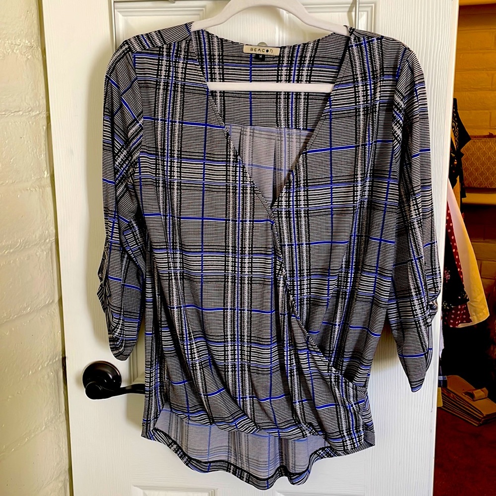 Plaid crossover knit top